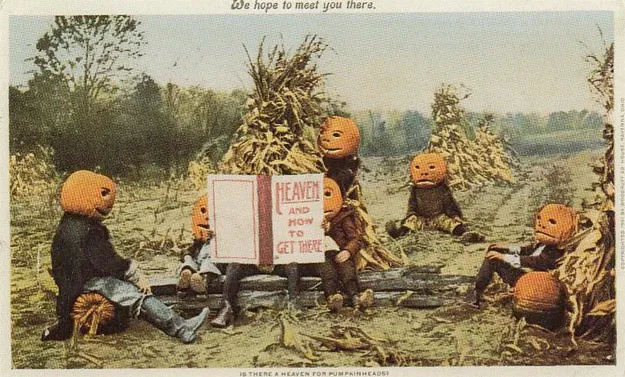 A vintage postcard showing figures with pumpkins instead of heads sitting around in a field. A sign in the center of the frame reads "Heaven and how to get there".